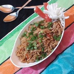 A picture of Triple schezwan fried rice.