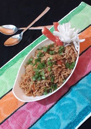 A picture of Triple schezwan fried rice.