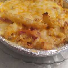 Una foto de Patatas bacon y queso estilo Foster hollywod