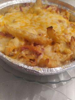 Una foto de Patatas bacon y queso estilo Foster hollywod
