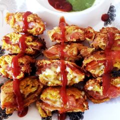 A picture of Tomato Cheese Bonda.