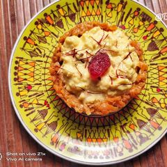 A picture of Keshari paneer basundi in gajar ki katori.