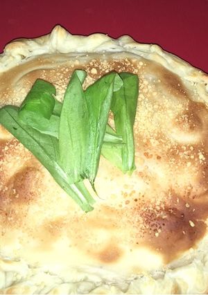 Una foto de Tarta de queso, cebolla y tomate