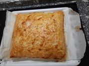 Una foto de empanada bechamel