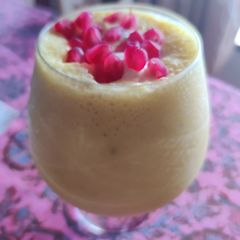 A picture of Mango milkshake with vanilla ice cream.