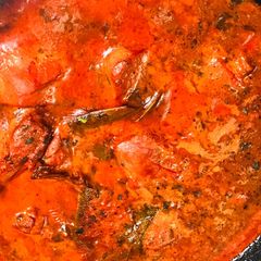 A picture of Red chicken gravy.