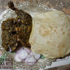 Green malai tikka with paratha A picture of Green malai tikka with paratha.