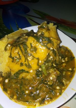 A picture of Ogbono and okro soup with Garri.