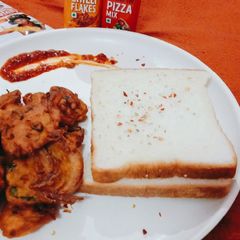 A picture of Schezwan onion fritters.