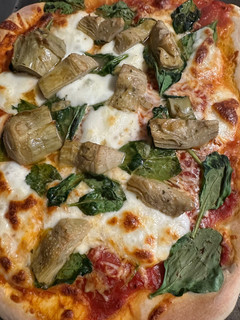 A picture of Artichoke Spinach Pizza.
