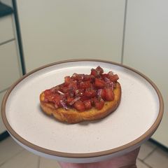 A picture of Truffle Kissed Confit Bruschetta (Best EVER) 🍅.