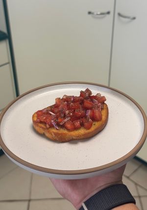 A picture of Truffle Kissed Confit Bruschetta (Best EVER) 🍅.