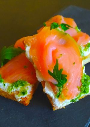 A picture of Bruschetta with Smoked Salmon, Ricotta, and Mint Pesto.