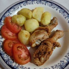 A picture of Baked marinated chicken with potatoes.