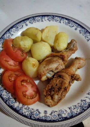 A picture of Baked marinated chicken with potatoes.