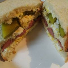 A picture of Triple with a Pickle Sandwich.