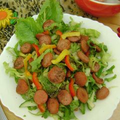 A picture of Veggie Salad with Sausages.