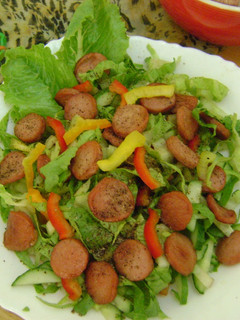 A picture of Veggie Salad with Sausages.