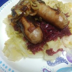 A picture of Beer Brats and Cabbage.