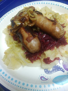 A picture of Beer Brats and Cabbage.