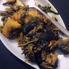 A picture of Yam porriage with snail and ugba.