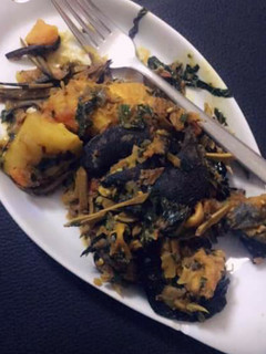 A picture of Yam porriage with snail and ugba.