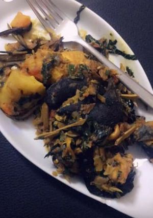 A picture of Yam porriage with snail and ugba.