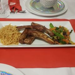 A picture of Pork Ribs, Noodles and mixed vegetables.