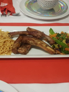 A picture of Pork Ribs, Noodles and mixed vegetables.