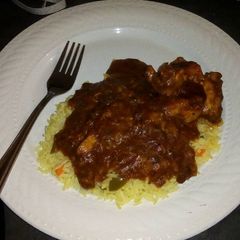 Tomato chilli chicken with savoury rice A picture of Tomato chilli chicken with savoury rice.