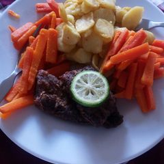 A picture of Fish potato buttered carrots.