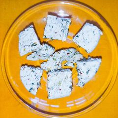 A picture of Paneer with herbs.