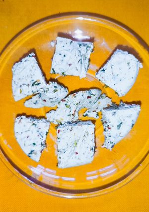 A picture of Paneer with herbs.