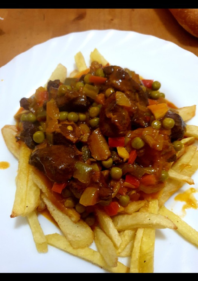 Una foto de Carne en tomate con verdura