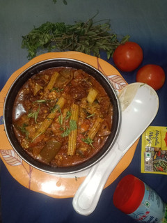 A picture of Drumstick, Eggplant, and Lentil Dumpling Curry.