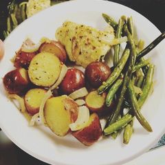 A picture of One pan Baked Chicken and veggies.