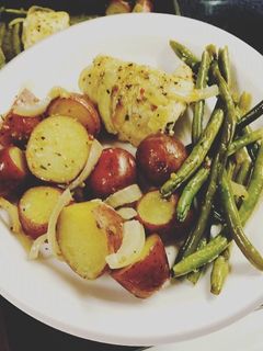 A picture of One pan Baked Chicken and veggies.