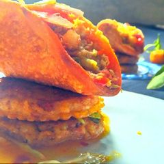 A picture of Chicken vegetable cutlus with chicken tacos.