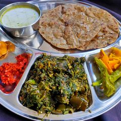 A picture of Fenugreek leaves with brinjals sabzi.