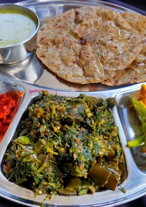 A picture of Fenugreek leaves with brinjals sabzi.