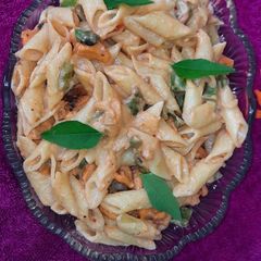 A picture of Pasta in creamy peri peri sauce.