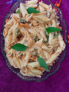 A picture of Pasta in creamy peri peri sauce.