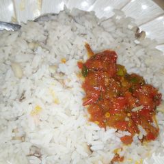 A picture of Rice and beans with soup.