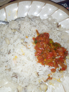 A picture of Rice and beans with soup.