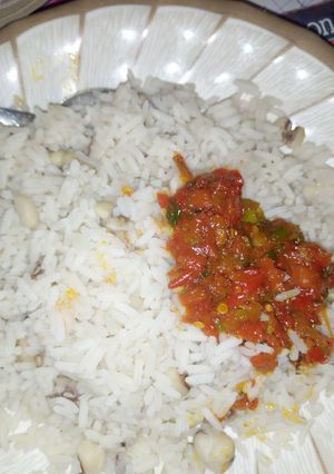 A picture of Rice and beans with soup.