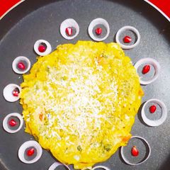 Cheesy Daliya Omlette A picture of Cheesy Daliya Omlette.
