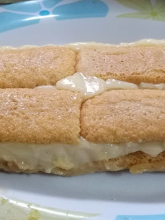 Una foto de Postre borrachito con vainillas y pastelera