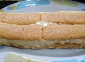 Una foto de Postre borrachito con vainillas y pastelera