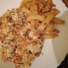 A picture of Omelette with fries.