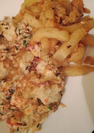 A picture of Omelette with fries.